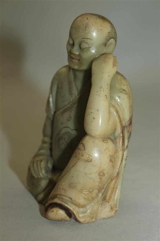 A Chinese soapstone seated figure of a luohan, 17th / 18th century, 10.5cm